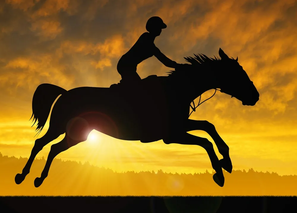 Black and white picture of “Name” jockey riding a horse fastly